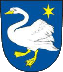 Das Stadtwappen der Partnerstadt Braunau mit einem weißen Schwan auf blauem Hintergrund. Oben rechts befindet sich ein gelber Stern.